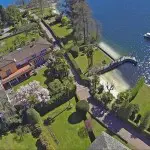 Luxury Swiss villa property for sale, Locarno on Lake Maggiore with private beach and dock. Rolls Royce Phantom and boat included. Indoor pool, three independent staff apartments, perfectly maintained garden, private beach and jetty dock.