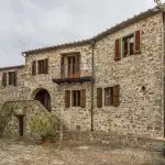 Tuscan Estate with three apartments, annexes, vineyard, 16.7 hectares of land and chapel for sale in in the Chianti Classico area, a few km from Greve in Chianti.