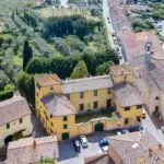 Aerial view of villa at Tuscan vineyard for sale