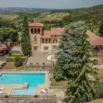 Aerial view of Tuscan villa and vineyard estate for sale