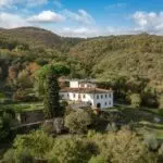 Aerial view of large Tuscan villa and surroundings